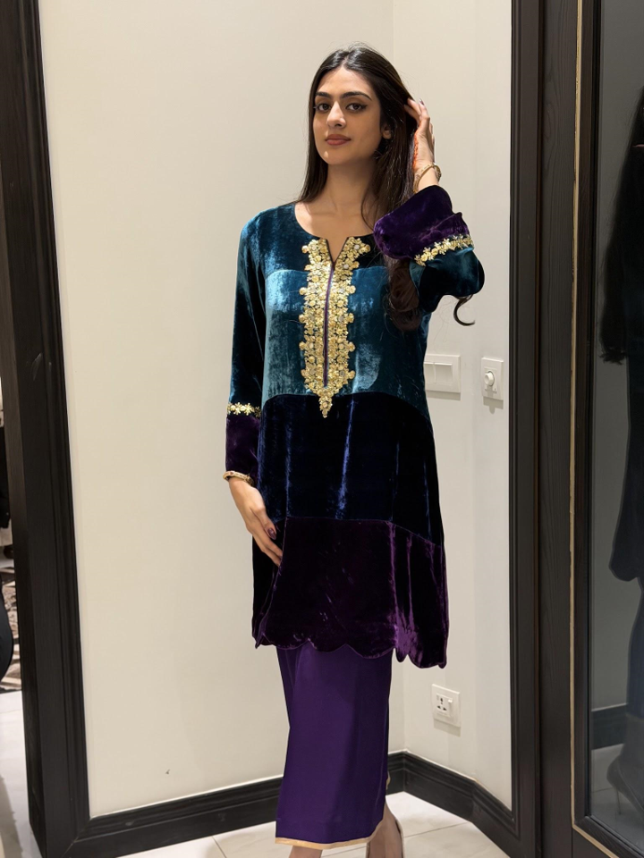 Short color-block pure French velvet shirt in teal and purple with gold gota work and pants.