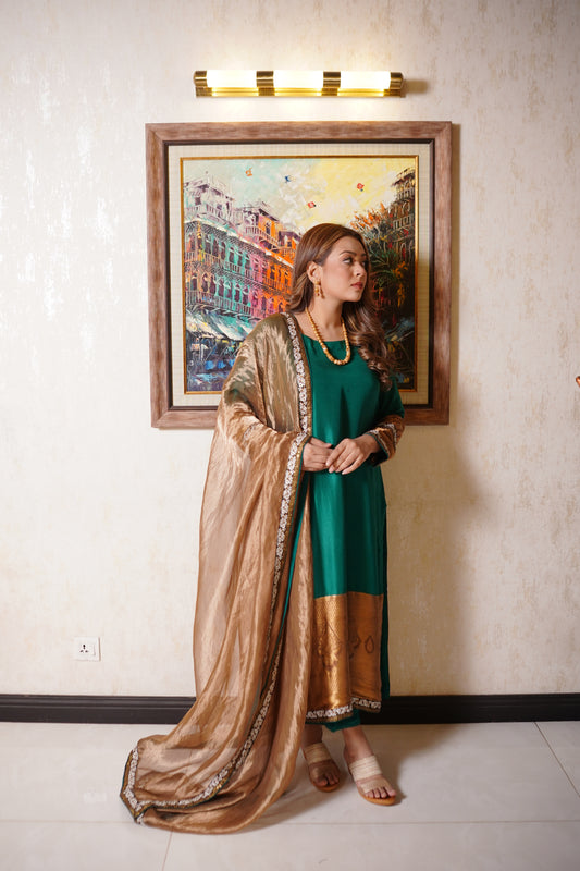Diva Emerald green raw silk and atlas jamawar color block shirt with gold tissue dupatta.