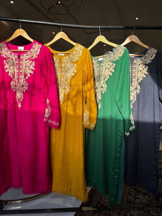 Pure pashmina tunic with ivory Aari embroidery on neckline paired with plain pashmina pants.