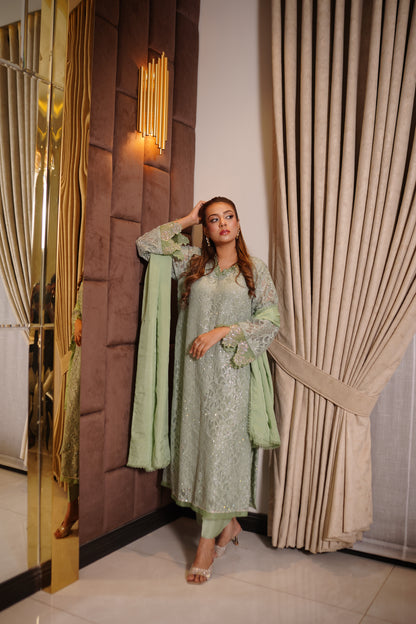 Mint green Shimmer Chantelle net suit with all-over Swarovski gems and lace trimmed dupatta.