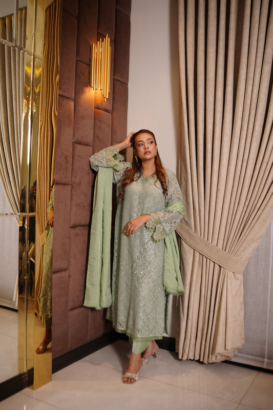 Mint green Shimmer Chantelle net suit with all-over Swarovski gems and lace trimmed dupatta.